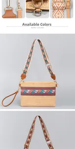 Macro detail of hand-woven straw envelope bag with colorful geometric embroidery and straps