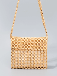 Handcrafted wooden bead crossbody bag with woven texture and natural wood finish