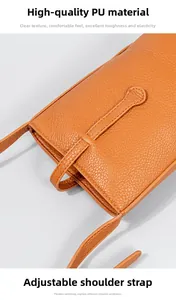Detalle de la textura de cuero PU naranja y correa ajustable del bolso de hombro para móvil