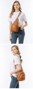 Detailed view of brown lychee texture leather chest bag with geometric woven strap