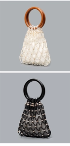 Detail showing contrast woven beaded handbags in cream and black with round top handles