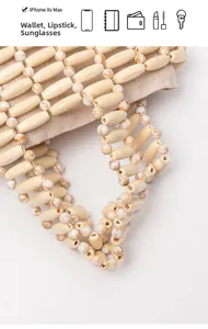 Detail showing the wooden bead bag capacity for phone, wallet, sunglasses and lipstick