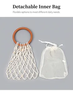 Detail of beaded tote bag featuring a detachable drawstring inner pouch and resin handle