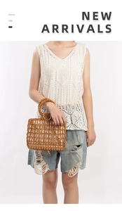 Detail of handmade brown wooden bead handbag with cream fabric liner and round handles