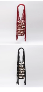 Detail of handmade mesh bucket bag with shell accents and drawstring liner for travel