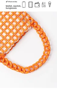 Detail view of orange beaded bag capacity showing space for phone, wallet, and lipstick