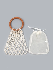 Handmade pearl bead woven tote bag with resin handles and white drawstring inner bag