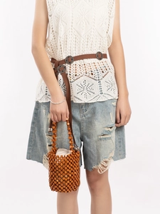 Handmade brown wooden bead bucket bag with a hollow design for casual boho travel styles