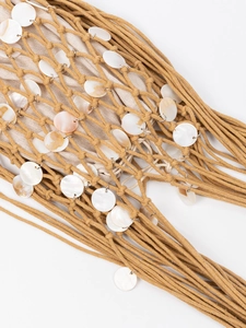 Handmade woven mesh shoulder bag in ginger yellow with lustrous shell disc ornaments
