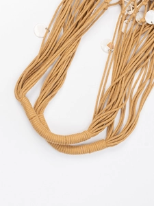 Handmade woven shoulder bag with camel cotton ropes and white shell accents in boho style