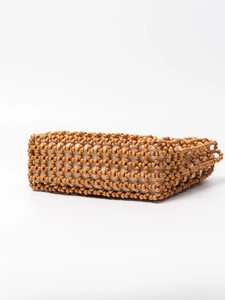Handmade bohemian wooden bead handbag with white fabric lining and woven grid pattern