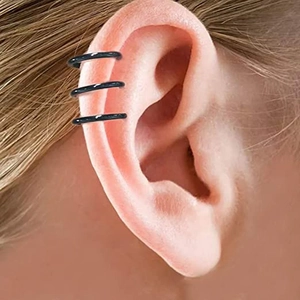 Set of three minimalist black stainless steel clip-on hoop earrings worn on the ear cartilage