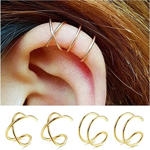 Set of gold cross and U-shaped ear cuffs shown on model and white background