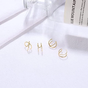 Gold-plated ear cuff set with minimalist criss-cross and double hoop non-piercing designs