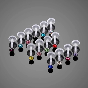 Set di 14 piercing labret in bioflex trasparente con cristalli colorati su fondo lucido