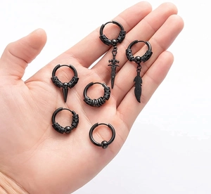 12-piece black stainless steel gothic earring set featuring sword, feather, and spike charms