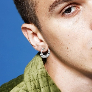 Silver dragon hoop earring for men on model with blue background and gothic style
