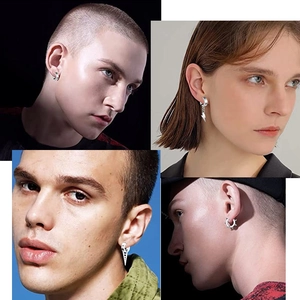 Zilveren punk oorbellen collectie met bliksem, spikes en kruis bedeltjes voor unisex