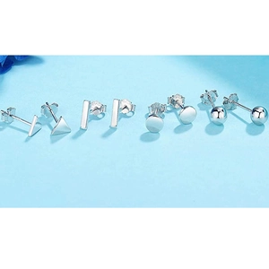 8-piece set of S925 silver geometric stud earrings with polished finish on blue background