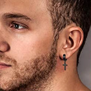 Matte black stainless steel hoop earring with cross pendant shown on male model