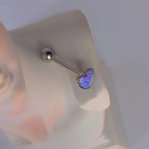 14G stainless steel tongue stud with a purple opal heart and beaded edge on ear model