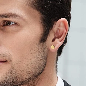 Classic 8mm round golden stainless steel stud earring on male model's ear