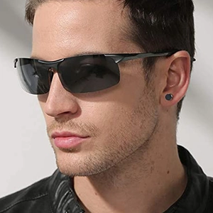 Men's polarized semi-rimless sunglasses and black round stud earring on a model