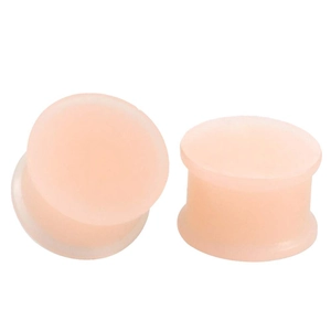 Flesh-colored soft silicone double flare ear gauges with matte translucent finish