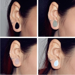 Polished teardrop stone ear plugs in black green pink and white quartz material