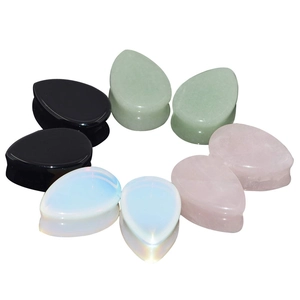 Polished teardrop stone ear plugs in opal, rose quartz, aventurine, and onyx stone