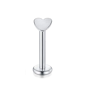 Detailed close-up of a silver stainless steel heart-shaped flat back lip stud and tragus piercer