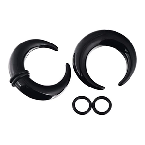Pair of glossy black acrylic crescent ear tapers with rubber O-rings on white background