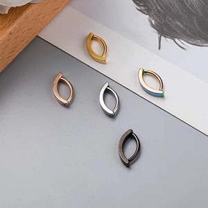 Polished stainless steel navel rings in five colors including gold silver and black