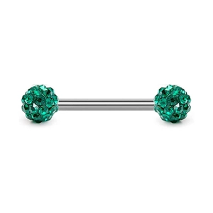 Macro detail of stainless steel barbell piercing with sparkling green crystal balls