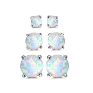 Three pairs of white opal stud earrings with four-claw setting in varied sizes
