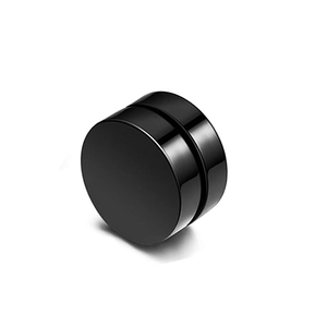 Macro shot of minimalist black cylindrical magnetic earrings with polished metal finish