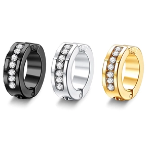 Detail of huggie earrings in black, silver and gold with sparkling rhinestone inlay