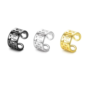 Three-piece set of wave-shaped stainless steel ear cuffs in black, silver, and gold finish