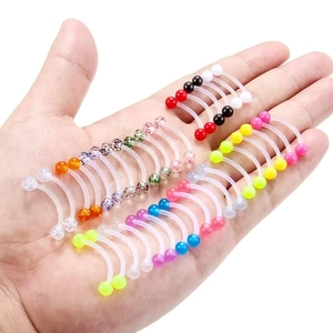 36-piece acrylic piercing set with colorful glitter and glow-in-the-dark curved barbells