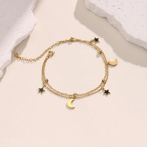 18K gold double-layer bracelet with black star charms and gold crescent moon pendants
