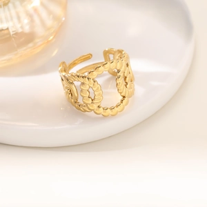 Close-up of gold 18K plated irregular hollow ring with interlaced link chain detail