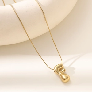 Polished 18K gold letter F bubble pendant necklace with delicate snake chain for women