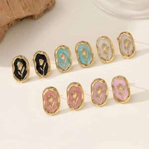 Set of vintage oval rose stud earrings in gold-toned finish with colorful floral enamel