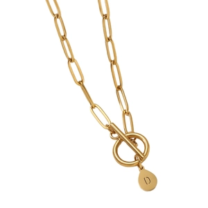 Gold paperclip chain necklace featuring a circular OT toggle clasp and D-letter pendant