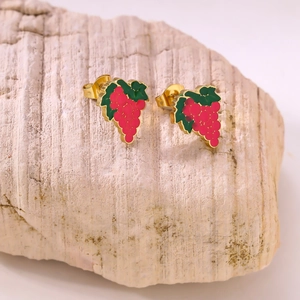 Detailed close-up of grape-shaped stud earrings with pink fruit and green leaves