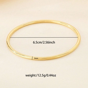 Macro view of 3mm gold titanium steel bangle with 6.5cm inner diameter measurement