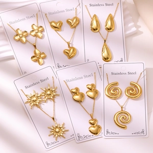 Detailed set of gold-plated stainless steel jewelry sets with clover and heart patterns
