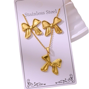 304 stainless steel gold plated jewelry set featuring 3D bow necklace and earrings
