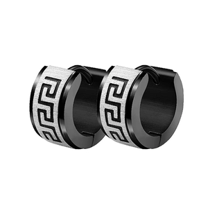 Detail of black and silver stainless steel earrings with Greek fret pattern engraving