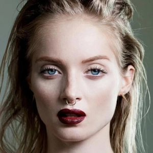 Minimalist silver stainless steel seamless septum ring worn on nose model face